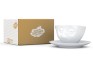 Kaffeetasse verpennt, neben Karton Kaffeetasse verpennt, neben Karton