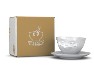 Kaffeetasse grinsend, neben Karton Kaffeetasse grinsend, neben Karton