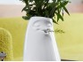 Vase mit Blume im Mund